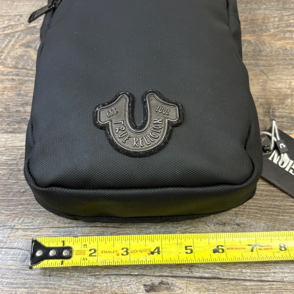 True Religion “Jody” Sling Bag | Black Logo Lined Crossbody